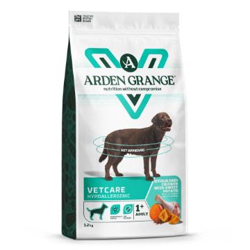 A 12 kg bag of Arden Grange Vetcare Hypoallergenic dog food, featuring a white bag with teal and black graphics, a brown dog illustration, and illustrations of chicken and carrots.