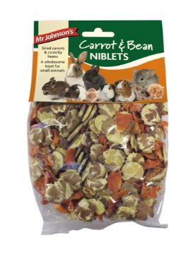Mr. Johnson's Carrot & Bean Niblets for small pets in a clear plastic bag with a green and orange header card, showing mixed dried vegetables and beans inside.