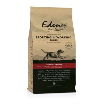 A bag of Eden The Pet Food Company dog food, specifically 'Country Cured' Sporting and Working Dogs, in a kraft paper style bag with a black bottom section and a red accent band.