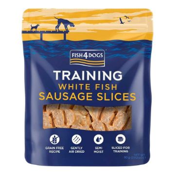 A bag of Fish4Dogs Training White Fish Sausage Slices dog treats on a plain white background. The packaging is dark blue with a yellow and orange sunset illustration at the top, white and yellow text, and a clear window showing the sliced fish sausage inside.