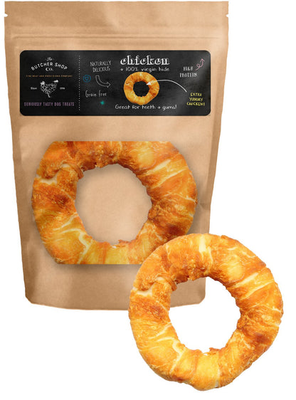 A packaged chicken ring wrap product from The Butcher Shop Co., with the packaging showing the product name and an image of the wrapped chicken.