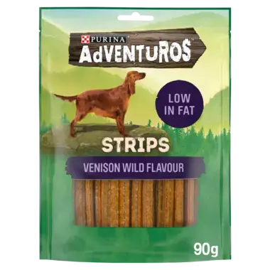 Purina Adventuros dog treats in a green stand-up pouch. The package shows a brown dachshund illustration, a purple 'LOW IN FAT' badge, and 'VENISON WILD FLAVOUR STRIPS' with visible brown treat sticks through a clear window.