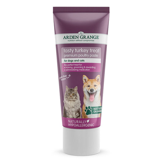 A tube of Arden Grange tasty turkey treat paste with images of a dog and a cat on the label.