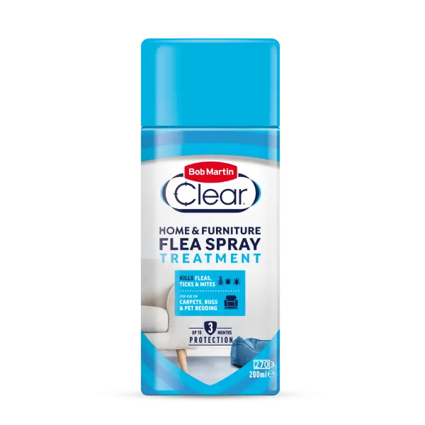 A bottle of Bob Martin Clear Home & Furniture Flea Spray Treatment, featuring a bright blue cap and a white and blue label with product details.