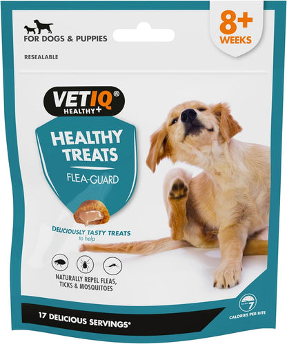 A package of VetIQ Healthy Dog Treats Flea Guard featuring an image of a golden retriever puppy. The package highlights that it is for dogs and puppies, naturally repels fleas, ticks, and mosquitoes, and includes 17 delicious servings.