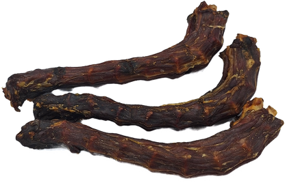 A group of dried duck necks, likely to be used as dog treats.