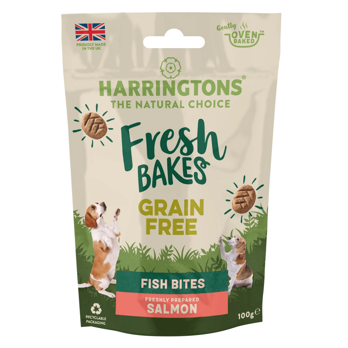 A 100g stand-up pouch of Harringtons Fresh Bakes Grain Free Fish Bites (Salmon flavor) for dogs. The packaging features a beige background with green and yellow text, illustrations of two beagle dogs jumping, and a green bottom section.