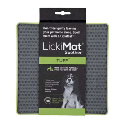 Packaging of Lickimat Tuff Soother pet mat with product visible through a window on the box, featuring a dog treat on the mat, and product details including size and material.